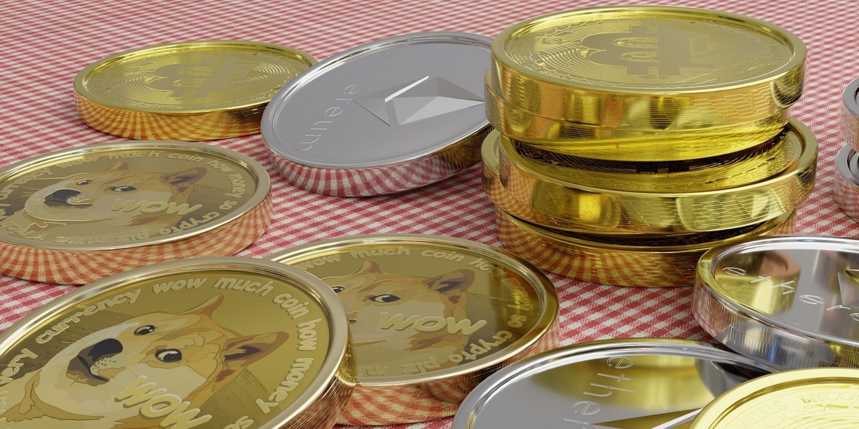 bitcoin dogecoin and ethereum coins on table